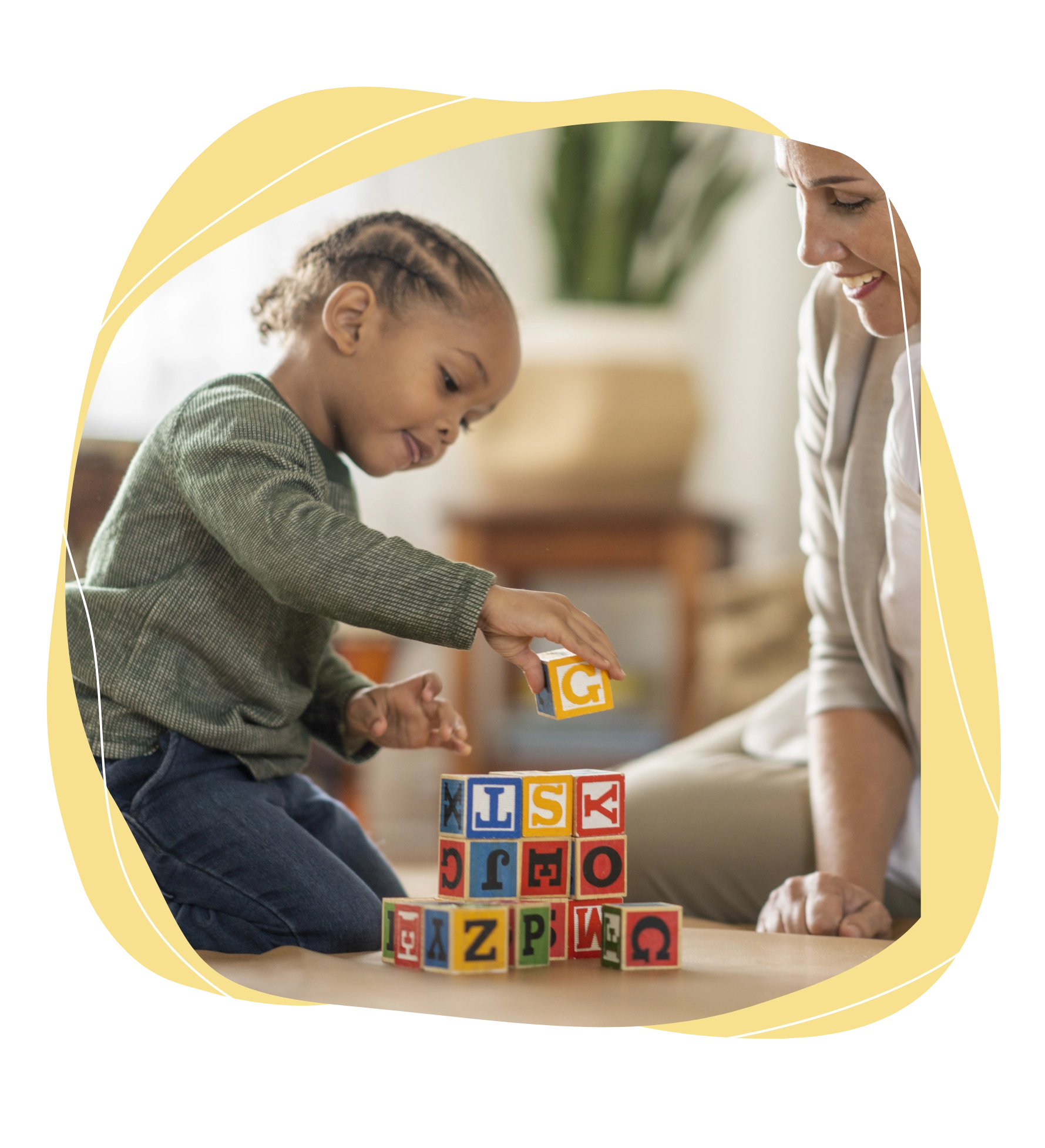 child stacking wooden cubes